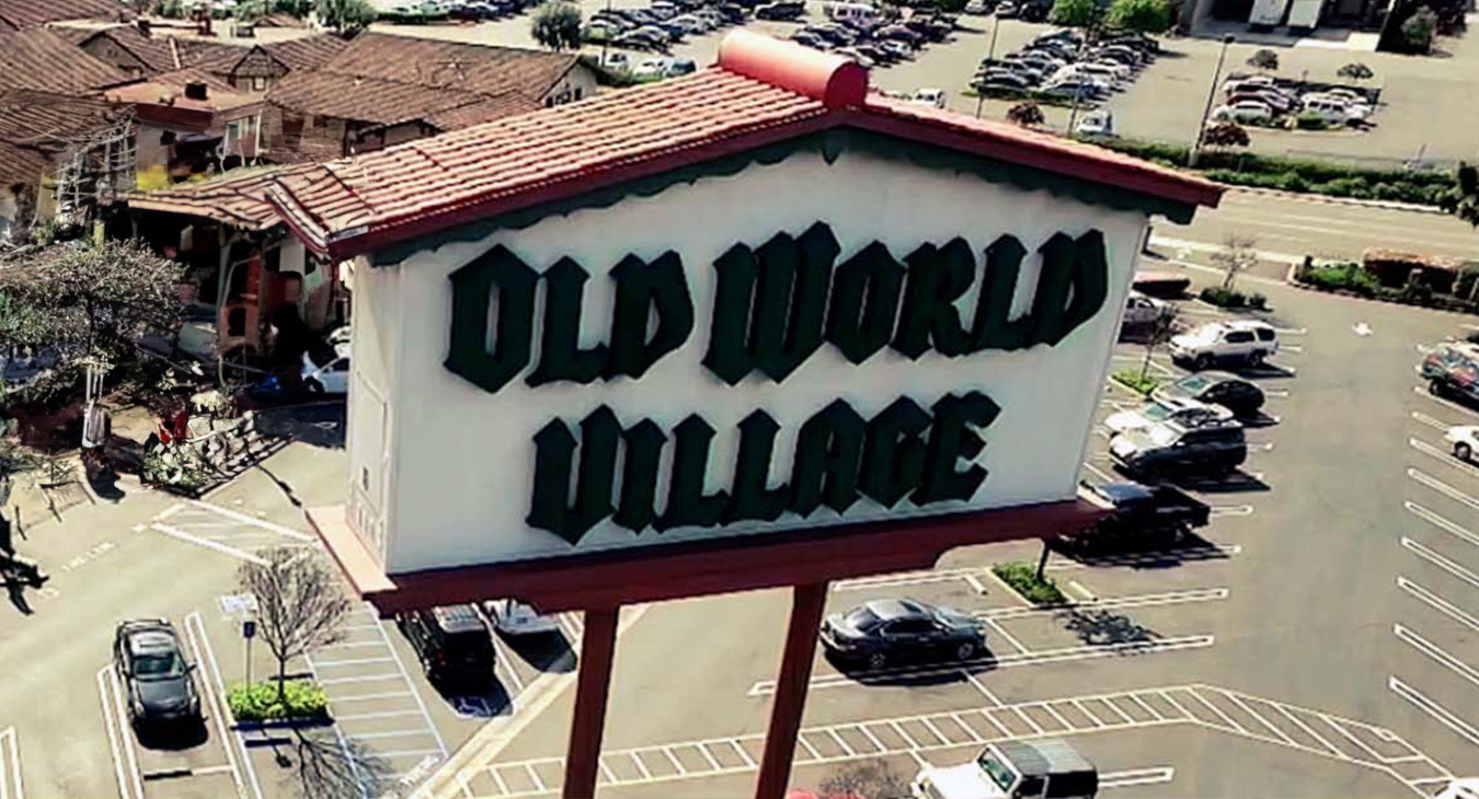 The Old World Village Sign